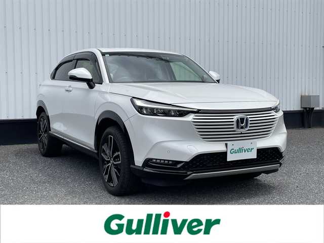 ホンダ ヴェゼル ハイブリッド e:HEV Z 千葉県 2023(令5)年 0.8万km プラチナホワイトパール 純正9インチナビ/（フルセグTV/BT/FM/AM）/全周囲カメラ/衝突被害軽減システム/車線逸脱警報/クルーズコントロール/横滑り防止装置/ETC2.0/前後ドライブレコーダー/アイドリングストップ/LEDヘッドライト/オートライト/ウィンカーミラー/電動格納ミラー/純正18インチAW/電動リアゲート/ハーフレザーシート/シートヒーター/ワイヤレス充電器/プッシュスタート/スマートキー/フロアマット/ドアバイザー/スペアキー/取扱説明書/保証書