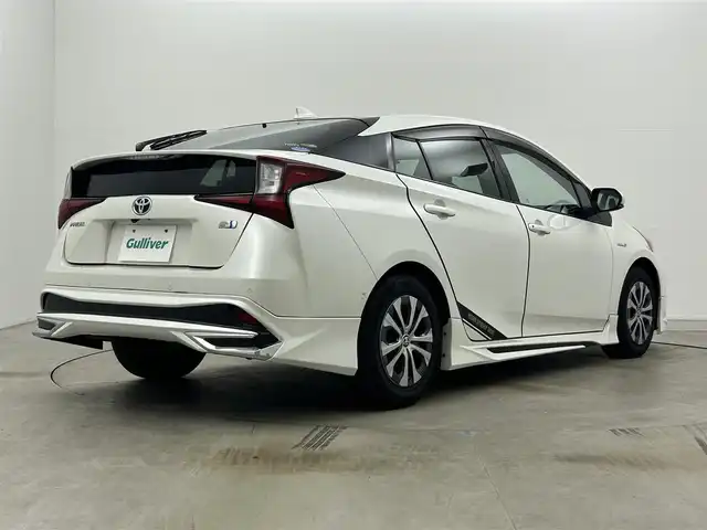 トヨタ プリウス A プレミアム 岡山県 2019(平31)年 7.2万km ホワイトパールクリスタルシャイン モデリスタエアロ/純正9インチナビ/・FM/AM/Bluetooth/フルセグ/CD/DVD/バックカメラ/合皮シート/・パワーシート/・ベンチレーション/アクセサリーコンセント/パーキングアシスト/ビルトインETC/ドライブレコーダー/トヨタセーフティーセンス/・プリクラッシュセーフティ/・レーンキープアシスト/・コーナーセンサー/・レーダークルーズコントロール/・オートマチックハイビーム/HUD/LEDヘッドライト/・フォグライト/純正フロアマット