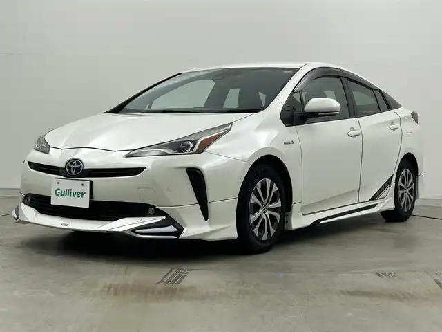 トヨタ プリウス A プレミアム 岡山県 2019(平31)年 7.2万km ホワイトパールクリスタルシャイン モデリスタエアロ/純正9インチナビ/・FM/AM/Bluetooth/フルセグ/CD/DVD/バックカメラ/合皮シート/・パワーシート/・ベンチレーション/アクセサリーコンセント/パーキングアシスト/ビルトインETC/ドライブレコーダー/トヨタセーフティーセンス/・プリクラッシュセーフティ/・レーンキープアシスト/・コーナーセンサー/・レーダークルーズコントロール/・オートマチックハイビーム/HUD/LEDヘッドライト/・フォグライト/純正フロアマット