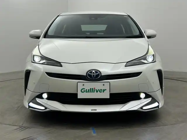 トヨタ プリウス A プレミアム 岡山県 2019(平31)年 7.2万km ホワイトパールクリスタルシャイン モデリスタエアロ/純正9インチナビ/・FM/AM/Bluetooth/フルセグ/CD/DVD/バックカメラ/合皮シート/・パワーシート/・ベンチレーション/アクセサリーコンセント/パーキングアシスト/ビルトインETC/ドライブレコーダー/トヨタセーフティーセンス/・プリクラッシュセーフティ/・レーンキープアシスト/・コーナーセンサー/・レーダークルーズコントロール/・オートマチックハイビーム/HUD/LEDヘッドライト/・フォグライト/純正フロアマット