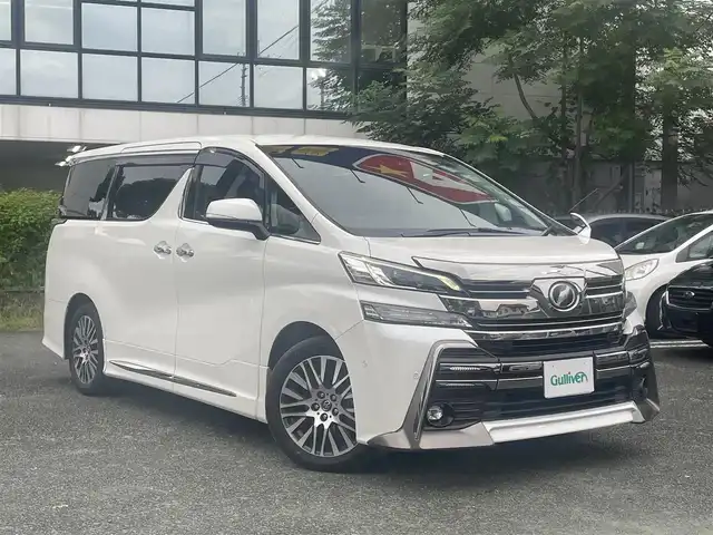 トヨタ ヴェルファイア ZA Gエディション 熊本県 2017(平29)年 7.4万km ホワイトパールクリスタルシャイン 革シート/プッシュスタート/純正ナビ/（CD・DVD・フルセグTV・BTオーディオ・SD）/JBLサウンド/バックカメラ/ビルトインETC/ドライブレコーダー/社外レーダー/純正18インチAW/レーダークルーズ/両側パワースライドドア/パワーバックドア/前席パワーシート・右前席シートメモリー/前席シートヒーター/ステアリングヒーター/LEDヘッドライト/オートライト/フォグライト/前後コーナーセンサー/横滑り防止装置/ウィンカーミラー/純正フロアマット/純正ドアバイザー/新車保証書/取扱説明書/スマートスペアキー×2本
