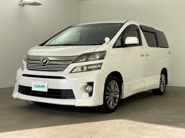 トヨタ ヴェルファイア 2．4Z ゴールデンアイズⅡ 兵庫県 2014(平26)年 9.2万km ホワイトパールクリスタルシャイン ・アルパイン製9インチナビ＆フルセグ＆BT＆DVD/・バックカメラ/・アルパイン製フリップダウンモニター/・両側パワースライドドア/・コーナーセンサー/・ハーフレザーシート/・純正18インチアルミホイール/・スマートキー/・スペアキー/・プッシュスタート/・フロアマット/・2列目オットマン/・カロッツェリア製スピーカー/・パワーバックドア/・電動格納ミラー/・LEDヘッドライト/・オートライト
