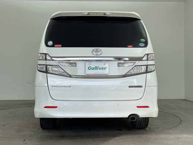 トヨタ ヴェルファイア 2．4Z ゴールデンアイズⅡ 兵庫県 2014(平26)年 9.2万km ホワイトパールクリスタルシャイン ・アルパイン製9インチナビ＆フルセグ＆BT＆DVD/・バックカメラ/・アルパイン製フリップダウンモニター/・両側パワースライドドア/・コーナーセンサー/・ハーフレザーシート/・純正18インチアルミホイール/・スマートキー/・スペアキー/・プッシュスタート/・フロアマット/・2列目オットマン/・カロッツェリア製スピーカー/・パワーバックドア/・電動格納ミラー/・LEDヘッドライト/・オートライト
