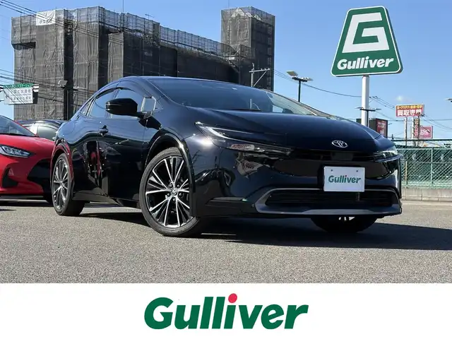 トヨタ プリウス Z 大分県 2023(令5)年 3.2万km アティチュードブラックマイカ ・純正ナビ(BT/Miracast/USB)/・全方位カメラ/・フルセグテレビ/・純正プレミアムスピーカー/・AC100V/・レーダークルーズコントロール/・プリクラッシュセーフティ/・ブラインドスポットモニター/・ETC2.0/・パワーシート/・シートメモリー/・デジタルインナーミラー/・ステアリングヒーター/・オートハイビーム/・パーキングアシスト/・ブレーキホールド/・電動リアゲート/・スマートキー/・純正アルミホイール