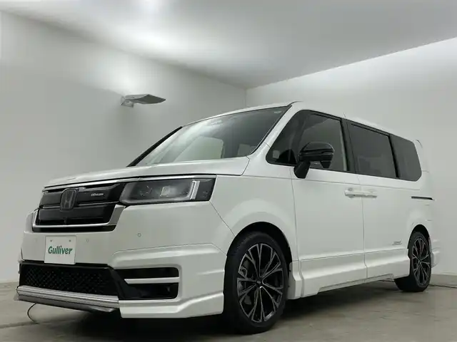 ホンダ ステップワゴン スパーダ eHEV プレミアムライン 岡山県 2023(令5)年 0.8万km プラチナホワイトパール 無限フルエアロ（F/S/RF)/無限18インチAW/無限フロントグリル/無限ドアミラーカバー/純正１１．４インチナビ/（Bluetooth/CD/DVD/フルセグTV）/ハーフレザー/衝突軽減ブレーキ/レーダークルーズコントロール/アラウンドビューモニター/ビルトインＥＴＣ２．０/ＬＥＤヘッドライト/オートハイビーム/フォグランプ/シートヒーター/ブラインドスポットモニター/純正ドライブレコーダー（前後）/パドルシフト/USB接続/フロアマット/両側パワースライドドア