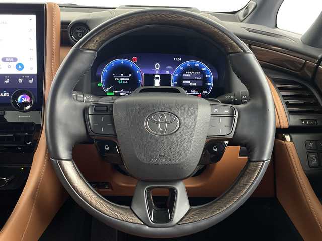 トヨタ ヴェルファイア ハイブリット エグゼクティブ ラウンジ 埼玉県 2023(令5)年 1.7万km プラチナホワイトパールマイカ 純正フリップダウンモニター/JBLプレミアムサウンド/左右独立ムーンルーフ/純正ナビ/(Bluetooth/HDMI/USB/AM/FM)/地デジフルセグ/CD/DVDキッド/全方位カメラ/前後ドライブレコーダー/ETC2.0/アダプティブクルーズコントロール/衝突軽減ブレーキ/ブラインドスポットモニター/車線逸脱警報/クリアランスソナー/オートマチックハイビーム/シートメモリー/シートヒーター・ベンチレーション/置くだけ充電/デジタルインナーミラー/パドルシフト/電子パーキングシステム/ブレーキホールド/電動格納ミラー/ウィンカーミラー/フロントフォグランプ/プッシュスタート/ステアリングリモコン/純正フロアマット/ドアバイザー/純正19インチアルミホイール