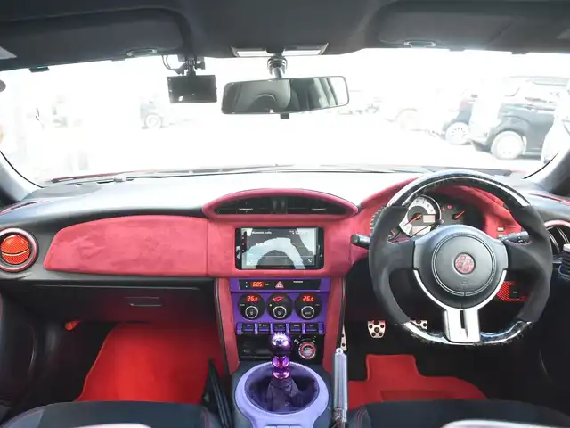 トヨタ ８６ GT リミテッド 神奈川県 2012(平24)年 5.7万km ライトニングレッド USトヨタ直輸入純正エンブレム/モデリスタエアロ（F・S・R）/TOM’S4本出しマフラー/：TOM’S4スモークテールレンズ/車高調/社外ディスプレイオーディオ/Bluetooth/バックカメラ/FM/AM/パイオニアパワードサブウーファー（）/プッシュスタート/ドライブレコーダー（前後）/社外シルバーメッキ19インチアルミホイール/：235/35R19/ハーフレザーシート/：シートヒーター前席/フロアマット