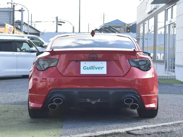トヨタ ８６ GT リミテッド 神奈川県 2012(平24)年 5.7万km ライトニングレッド USトヨタ直輸入純正エンブレム/モデリスタエアロ（F・S・R）/TOM’S4本出しマフラー/：TOM’S4スモークテールレンズ/車高調/社外ディスプレイオーディオ/Bluetooth/バックカメラ/FM/AM/パイオニアパワードサブウーファー（）/プッシュスタート/ドライブレコーダー（前後）/社外シルバーメッキ19インチアルミホイール/：235/35R19/ハーフレザーシート/：シートヒーター前席/フロアマット