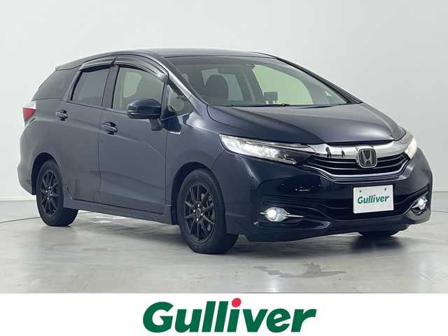 ホンダ シャトル ハイブリッド X ホンダセンシング 岐阜県 2018(平30)年 10万km ミッドナイトブルービームM ホンダセンシング/社外8インチナビ/（CD/DVD/Bluetooth/SD）/バックカメラ/レーダークルコン/前方ドライブレコーダー/前席シートヒーター/ハーフレザーシート/パドルシフト/ステアリングスイッチ/フォグランプ/オートLEDヘッドライト/プッシュスタート/スマートキー/ビルトインETC