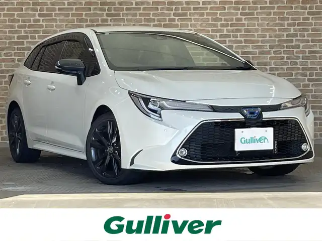 トヨタ カローラツーリング ハイブリッド ダブルバイビー 岩手県 2021(令3)年 8.8万km ホワイトパールクリスタルシャイン ４WD/ヘッドアップディスプレイ/トヨタセーフティセンス/プリクラッシュセーフティ/レーダークルーズコントロール/レーントレーシングアシスト/オートマチックハイビーム/ブラインドスポットモニター/リヤクロストラフィックアラート/クリアランスソナー/横滑り防止装置/オートブレーキホールド/前席シートヒーター/ステアリングヒーター/AC100V1500Wアクセサリーコンセント/純正ディスプレイオーディオ/ナビゲーション機能/フルセグTV/CD・DVDデッキ/バックカメラ/ETC2.0/ドライブレコーダー/LEDヘッドランプ/純正１７インチアルミホイール