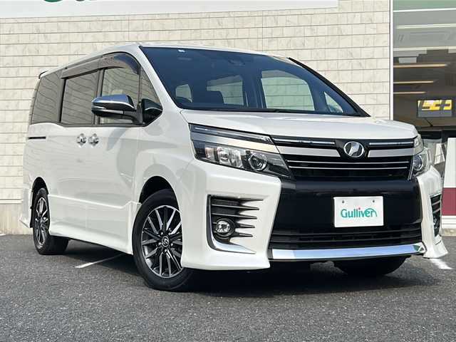 トヨタ ヴォクシー ZS 煌Ⅱ 千葉県 2016(平28)年 9万km ホワイトパールクリスタルシャイン ワンオーナー/純正9型SDナビ【NSZT-Y66T】/フルセグTV/DVD/CD/Bluetooth/12型フリップダウンモニター/バックカメラ/ETC/衝突軽減ブレーキ/レーンキープアシスト/LEDヘッドライト/純正16インチアルミホイール/スマートキー/LEDヘッドライト/オートライト/ステアリングスイッチ/ドアバイザー/社外フロアマット/スペアキー/保証書/取扱説明書