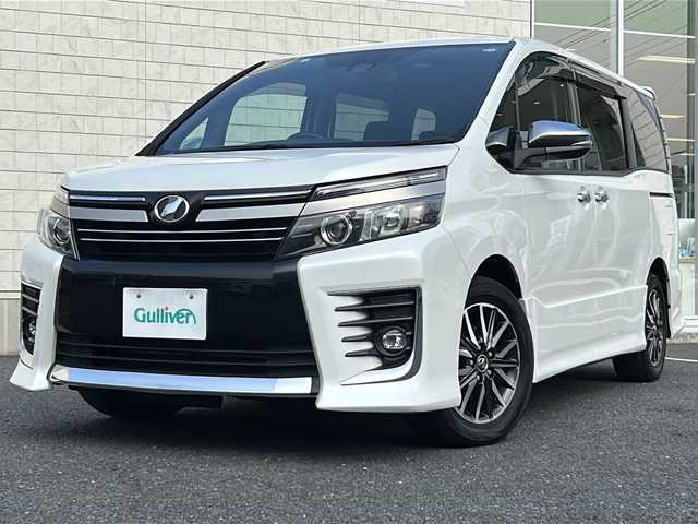 トヨタ ヴォクシー ZS 煌Ⅱ 千葉県 2016(平28)年 9万km ホワイトパールクリスタルシャイン ワンオーナー/純正9型SDナビ【NSZT-Y66T】/フルセグTV/DVD/CD/Bluetooth/12型フリップダウンモニター/バックカメラ/ETC/衝突軽減ブレーキ/レーンキープアシスト/LEDヘッドライト/純正16インチアルミホイール/スマートキー/LEDヘッドライト/オートライト/ステアリングスイッチ/ドアバイザー/社外フロアマット/スペアキー/保証書/取扱説明書