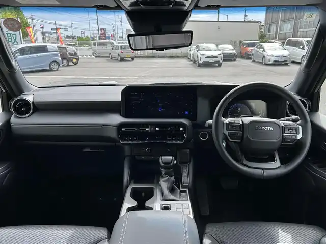 トヨタ ランドクルーザー ２５０ VX 愛知県 2024(令6)年 2.3万km アバンギャルドブロンズメタリック ワンオーナー/純正メモリナビ/フルセグテレビ/バックカメラ/アラウンドビュー/Bluetooth/ウィンカーミラー/クルーズコントロール/プッシュスタート/ビルトインETC2.0/パワーバックドア/デジタルインナーミラー/衝突軽減ブレーキ/BSM