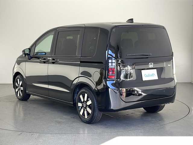ホンダ フリード ハイブリット e:HEV AIR EX 長野県 2025(令7)年 0.1千km クリスタルブラックパール 登録済未使用車/純正9インチナビ/（フルセグ/Bluetooth/AppleCarPlay/AndroidAuto)/バックカメラ/ホンダセンシング/・衝突軽減ブレーキ/・レーンキープアシスト/・レーダークルーズコントロール/・ブラインドスポットモニター/・踏み間違い防止/・前後コーナーセンサー/両側電動スライドドア/電子パーキング/リア席サンシェード/LEDヘッドライト/オートライト/ウィンカーミラー/ハーフレザーシート/取扱説明書/保証書/スマートキー/スペアキー
