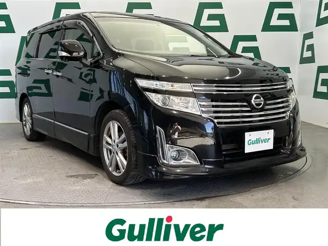 日産 エルグランド 250ハイウェイスター 鹿児島県 2010(平22)年 8.1万km ファントムブラック 禁煙車　/純正ナビ/・ワンセグTV/・Bluetooth/全方位カメラ　/フリップダウンモニター　/オットマン　/ロール式サンシェード　/カーテンエアバッグ　/ビルトインＥＴＣ　/純正アルミホイール　/純正ドアバイザー　/社外フロアマット　/スマートキー/プッシュスタート