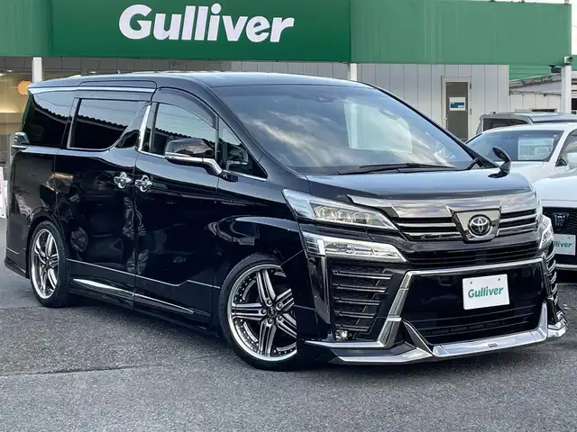 トヨタ ヴェルファイア ゴールデンアイズⅡ 千葉県 2021(令3)年 2.7万km ブラック ワンオーナー/モデリスタエアロ(F/S/R)/純正オプションナビ/・CD/DVD/Bluetooth/フルセグTV/純正12.1インチフリップダウンモニター/バックカメラ/両後パワースライドドア/パワーバックドア/トヨタセーフティーセンス/・プリクラッシュセーフティー/・レーンディパーチャーアラート/・パーキングサポートブレーキ/・ロードサインアシスト/・オートマチックハイビーム/・アダプティブクルーズコントロール/社外20インチアルミホイール【REIHEN】/スマートキー/前後コーナーセンサー/AC100V100W電源/純正LEDヘッドライト/フォグランプ/ビルトインETC/社外レザー調シートカバー/黒木目調パネル/サイド＆カーテンエアバッグ/ニーエアバッグ/新車時保証書＆取扱説明書