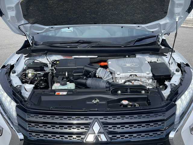 三菱 エクリプス クロス ＰＨＥＶ P 富山県 2022(令4)年 0.7万km ホワイトダイヤモンド 4WD/社外HDDナビ（CN-F1X10HD）/フルセグ/バックカメラ/ETC/ヘッドアップディスプレイ/衝突被害軽減ブレーキ/レーンキープアシスト/レーダークルーズコントロール/ブラインドスポットモニター/コーナーセンサー/パドルシフト/AC100V/1500W/ハーフレザーシート/運転席パワーシート/シートヒーター