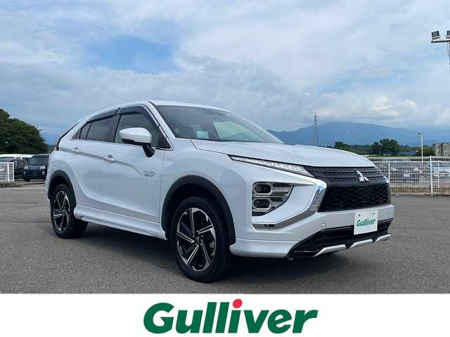 三菱 エクリプス クロス ＰＨＥＶ P 富山県 2022(令4)年 0.7万km ホワイトダイヤモンド 4WD/社外HDDナビ（CN-F1X10HD）/フルセグ/バックカメラ/ETC/ヘッドアップディスプレイ/衝突被害軽減ブレーキ/レーンキープアシスト/レーダークルーズコントロール/ブラインドスポットモニター/コーナーセンサー/パドルシフト/AC100V/1500W/ハーフレザーシート/運転席パワーシート/シートヒーター