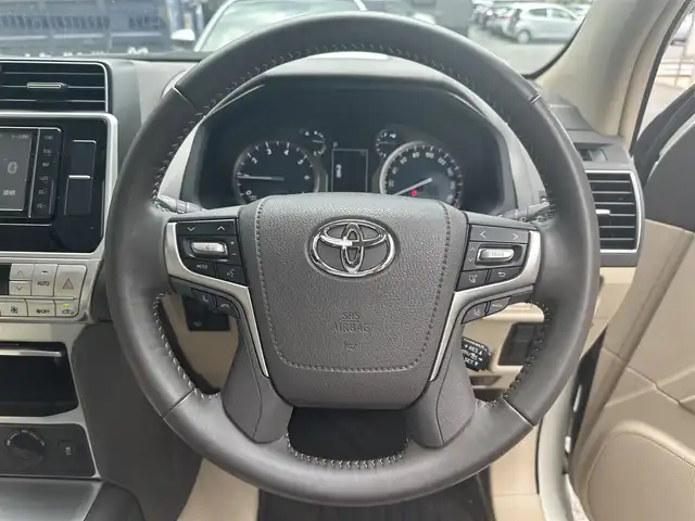 トヨタ ランドクルーザー プラド TX Lパッケージ マットブラED 滋賀県 2023(令5)年 0.6万km ホワイトパールクリスタルシャイン 禁煙車/純正７インチナビ/(SD/DVD/Bluetooth)/フルセグTV/レーダークルーズコントロール/ビルトインETC/コーナーセンサー/オートリトラミラー/シートヒーター/シートベンチレーション/サンルーフ/電動格納サードシート/自動防眩ミラー/プッシュスタート