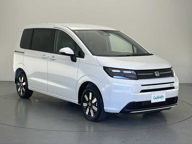 ホンダ フリード ハイブリット e:HEV AIR EX 長野県 2025(令7)年 0.1千km プラチナホワイトパール 4WD/届出済未使用車/純正9型メモリナビ/フルセグ&USB&BT&AppleCarPlay&AndoridAuto/ホンダセンシング/アダプティブクルーズコントロール/レーンキープアシスト/衝突軽減ブレーキ/コーナーセンサー/ブラインドスポットインフォメーション/両側パワースライドドア/ハーフレザーシート/前席シートヒーター/ステアリングスイッチ/ウォークスルー/バックカメラ/LEDヘッドライト/オートライト/オートマチックハイビーム/電動格納ミラー/ウィンカーミラー/純正15インチAW装着/プッシュスタート/スマートキー/スペアキー1本/取扱説明書/新車保証書