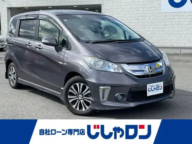 ホンダ フリード ハイブリット ジャストセレクション 東京都 2014(平26)年 8.2万km モダンスティールM (株)IDOMが運営する【じしゃロン昭島店】の自社ローン専用車両になります。こちらは現金またはオートローンご利用時の価格です。自社ローンご希望の方は別途その旨お申付け下さい/純正インターナビ/BT/フルセグ/DVD/CD/バックカメラ/前後ドライブレコーダー/ハーフレザーシート/両側パワースライドドア/ステアリングスイッチ/LEDライト/アルミ純正/フロアマット純正/チップアップシート