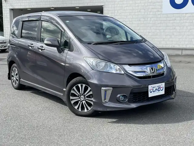ホンダ フリード ハイブリット ジャストセレクション 東京都 2014(平26)年 8.2万km モダンスティールM (株)IDOMが運営する【じしゃロン昭島店】の自社ローン専用車両になります。こちらは現金またはオートローンご利用時の価格です。自社ローンご希望の方は別途その旨お申付け下さい/純正インターナビ/BT/フルセグ/DVD/CD/バックカメラ/前後ドライブレコーダー/ハーフレザーシート/両側パワースライドドア/ステアリングスイッチ/LEDライト/アルミ純正/フロアマット純正/チップアップシート