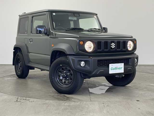 スズキ ジムニー シエラ JL 兵庫県 2022(令4)年 1.5万km ジャングルグリーン ・社外メモリーナビ（KXM-E507W）/　CD/DVD再生/　SDミュージックサーバー/　Bluetoothオーディオ/　フルセグテレビ/・バックカメラ/・ビルドインETC/・衝突被害軽減システム/・純正フロアマット/・シートヒーター（運転席・助手席）/・背面タイヤ/・純正15インチアルミホイール/・ABS/・横滑り防止機能/・盗難防止装置/・オートライト/・オートマチックハイビーム/・ダウンヒルアシストコントロール/・W＋サイドエアバック/・カーテンエアバック/・パートタイム４WD/・スマートキー/・スペアキー/・AACエアコン