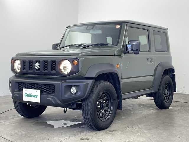 スズキ ジムニー シエラ JL 兵庫県 2022(令4)年 1.5万km ジャングルグリーン ・社外メモリーナビ（KXM-E507W）/　CD/DVD再生/　SDミュージックサーバー/　Bluetoothオーディオ/　フルセグテレビ/・バックカメラ/・ビルドインETC/・衝突被害軽減システム/・純正フロアマット/・シートヒーター（運転席・助手席）/・背面タイヤ/・純正15インチアルミホイール/・ABS/・横滑り防止機能/・盗難防止装置/・オートライト/・オートマチックハイビーム/・ダウンヒルアシストコントロール/・W＋サイドエアバック/・カーテンエアバック/・パートタイム４WD/・スマートキー/・スペアキー/・AACエアコン