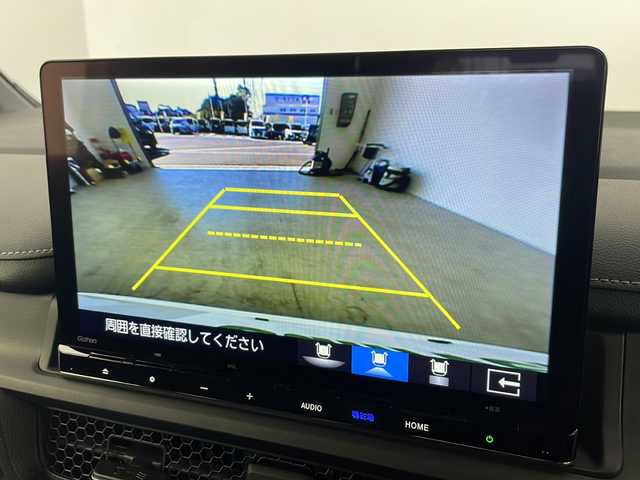 ホンダ ステップワゴン スパーダ eHEV 愛知県 2025(令7)年 0.1千km プラチナホワイトパール ・登録済未使用車/・純正11.4インチナビ/・Bluetooth/フルセグTV/CD/DVD/AppleCarPlay/・ハーフレザーシート/・D/Nシートヒーター/・パワーバックドア/・両側パワースライドドア/・2列目オットマン/・パドルシフト/・オートブレーキホールド/・オートLEDヘッドライト/・フォグライト/・スマートキー×２/・純正16インチアルミホイール/・サイド/カーテンエアバッグ/【ホンダセンシング】/・衝突軽減ブレーキ/・オートハイビーム/・誤発進抑制機能/・後方誤発進抑制機能/・路外逸脱警報機能/・アダプティブクルーズコントロール/・車線維持支援システム/・歩行者事故低減ステアリング^/・先行車発進お知らせ機能/・標識認識機能