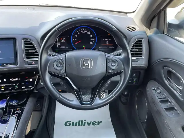 ホンダ ヴェゼル ハイブリッド RS ホンダセンシング 愛媛県 2018(平30)年 4.3万km ホワイトオーキッドパール 純正8インチナビ/AM/FM/CD/DVD/BT/フルセグTV　/ホンダセンシング　/バックカメラ　/アダプティブクルーズコントロール　/パドルシフト　/電動パーキングブレーキ　/純正フルエアロ　/ドラレコ/ETC/アルミペダル/アイドリングストップ/Ｄ/Ｎ席シートヒーター/革巻きステアリング/ハーフレザー/ＬＥＤヘッドライト/現状サマー(純正ＡＷ)(225/50/R18)