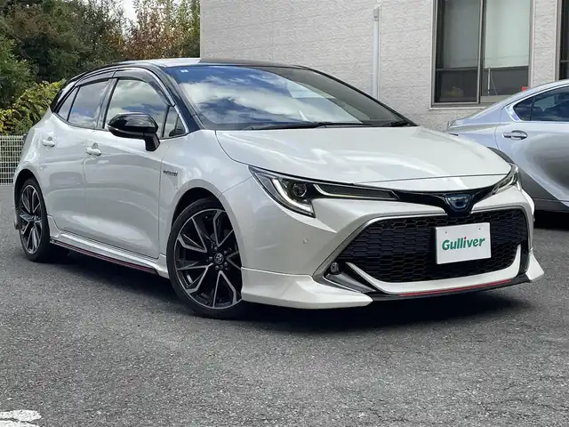 トヨタ カローラ スポーツ ハイブリッドG Z 静岡県 2020(令2)年 7.4万km アティチュードブラックマイカ/ホワイトパールクリスタルシャイン ワンオーナー/TRDエアロ/純正ナビ/フルセグTV/BT/バックカメラ/ハーフレザーシート/前席シートヒーター/前後ドライブレコーダー/ビルトインETC/プリクラッシュセーフティ/レーンキープアシスト/オートハイビーム/レーダークルーズコントロール/クリアランスソナー/ブラインドスポットモニター/LEDライト/LEDフォグ/スマートキー×2/保証書/取扱説明書/ナビ取扱説明書/R7点検記録簿有