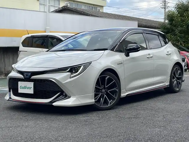 トヨタ カローラ スポーツ ハイブリッドG Z 静岡県 2020(令2)年 7.4万km アティチュードブラックマイカ/ホワイトパールクリスタルシャイン ワンオーナー/TRDエアロ/純正ナビ/フルセグTV/BT/バックカメラ/ハーフレザーシート/前席シートヒーター/前後ドライブレコーダー/ビルトインETC/プリクラッシュセーフティ/レーンキープアシスト/オートハイビーム/レーダークルーズコントロール/クリアランスソナー/ブラインドスポットモニター/LEDライト/LEDフォグ/スマートキー×2/保証書/取扱説明書/ナビ取扱説明書/R7点検記録簿有