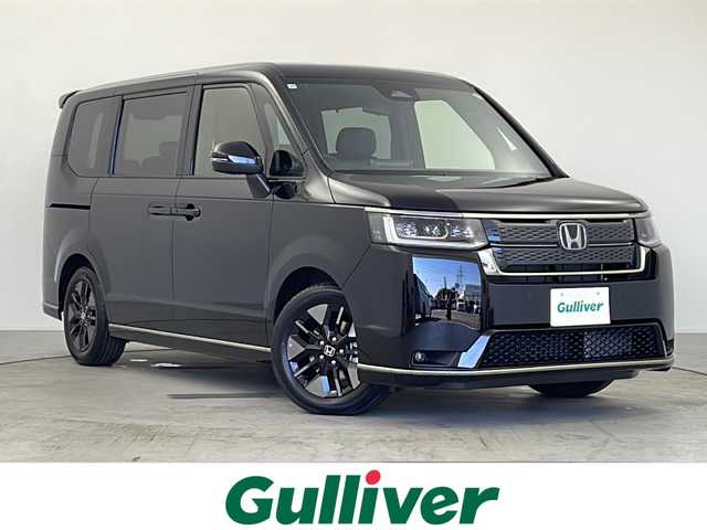 ホンダ ステップワゴン スパーダ eHEV 愛知県 2025(令7)年 0.1千km クリスタルブラックパール ・登録済未使用車/・純正11.4インチナビ/・Bluetooth/フルセグTV/CD/DVD/AppleCarPlay/・ハーフレザーシート/・D/Nシートヒーター/・パワーバックドア/・両側パワースライドドア/・2列目オットマン/・パドルシフト/・オートブレーキホールド/・オートLEDヘッドライト/・フォグライト/・スマートキー×２/・純正16インチアルミホイール/・サイド/カーテンエアバッグ/【ホンダセンシング】/・衝突軽減ブレーキ/・オートハイビーム/・誤発進抑制機能/・後方誤発進抑制機能/・路外逸脱警報機能/・アダプティブクルーズコントロール/・車線維持支援システム/・歩行者事故低減ステアリング^/・先行車発進お知らせ機能/・標識認識機能