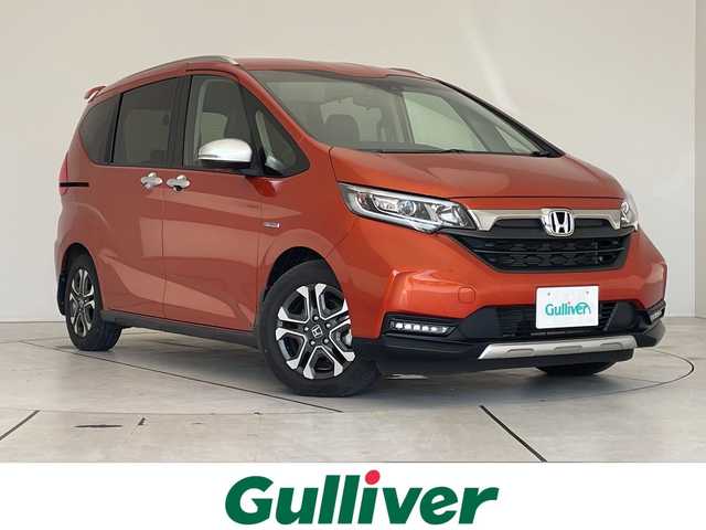 ホンダ フリード＋ ハイブリット クロスター ホンダセンシング 愛知県 2021(令3)年 3.4万km プレミアムクリスタルオレンジM 純正9型ナビ/フリップダウンモニター/両側パワースライドドア/レーダークルーズコントロール/シートヒーター/バックカメラ/コーナーセンサー/LEDヘッドライト/オートライト/ドライブレコーダー/ETC/衝突軽減システム/フルセグ/CD DVD/Bluetooth/ステアリングスイッチ/スマートキー/プッシュスタート