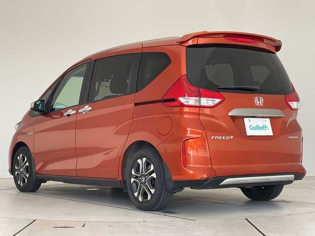 ホンダ フリード＋ ハイブリット クロスター ホンダセンシング 愛知県 2021(令3)年 3.4万km プレミアムクリスタルオレンジM 純正9型ナビ/フリップダウンモニター/両側パワースライドドア/レーダークルーズコントロール/シートヒーター/バックカメラ/コーナーセンサー/LEDヘッドライト/オートライト/ドライブレコーダー/ETC/衝突軽減システム/フルセグ/CD DVD/Bluetooth/ステアリングスイッチ/スマートキー/プッシュスタート