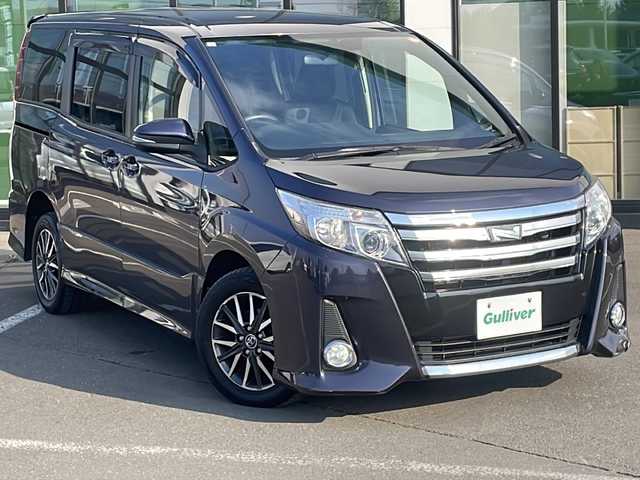 トヨタ ノア Si 道東・釧路十勝 2015(平27)年 7.6万km ダークバイオレットマイカメタリック ・4WD/・ワンオーナー/・寒冷地仕様/・ALPINESDメモリナビ/（BT・CD・DVD・USB・フルセグ・ラジオ）/・社外テレビキャンセラー/・アルパイン10.1インチフリップダウンモニター/・バックカメラ/・片側パワースライドドア/・スマートキー/・プッシュスタート/・MTモード付AT/・ETC/・LEDヘッドライト/・フォグライト/・オートライト/・アイドリングストップ/・純正フロアマット/・ドアバイザー/・純正16インチアルミホイール