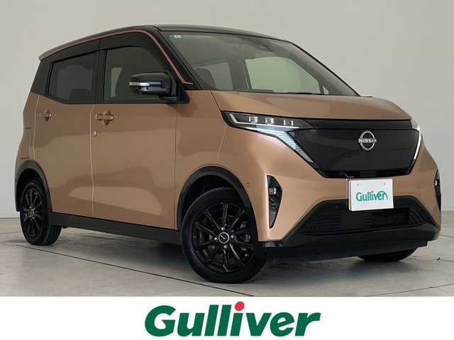 日産 サクラ G 愛知県 2022(令4)年 2.7万km 茶／シルバー プロパイロット/純正8型ディスプレイオーディオナビ/全方位カメラ/レーダークルーズコントロール/シートヒーター/コーナーセンサー/アルミホイール/ETC2.0/レーンキープアシスト/ドライブレコーダー/充電ケーブルあり/衝突軽減システム/フルセグ/Bluetooth/ステアリングスイッチ/スマートキー/プッシュスタート