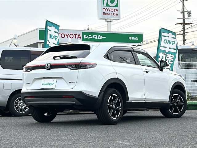 ホンダ ヴェゼル ハイブリッド e:HEV X 愛知県 2022(令4)年 0.6万km プラチナホワイトパール /禁煙車/ワンオーナー/ディーラー整備記録簿R4.5.6//9インチフローティングナビ/フルセグ/BT/USB//CD/DVD/SD/MSV//バックカメラ/前後ドラレコ/ETC//CMBS/ACC/LKAS/RSA//先行車発信告知/誤発進抑制/路外逸脱抑制//ステアリングスイッチ/パドルシフト//純正LEDオートライト/オートハイビーム//純正LEDフォグランプ//電動パーキングブレーキ//電動格納ウインカーミラー//前後クリソナ//ダウンヒルアシストコントロール//W＋サイドエアバック//カーテンエアバック//トノカバー/ドアバイザー/フロアマット//AW付きスタッドレスタイヤ4本積載//新車時保証書//取扱説明書//スペアキー有