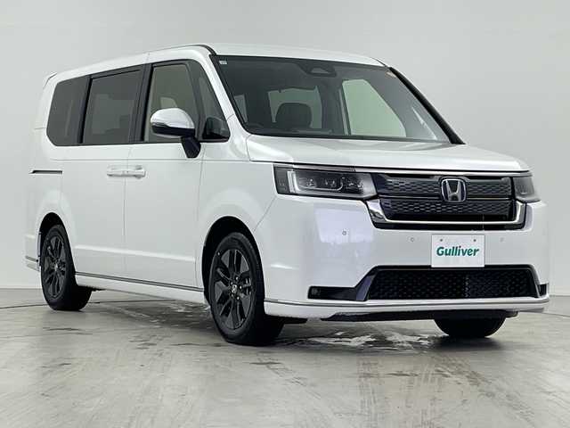 ホンダ ステップワゴン スパーダ eHEV 岐阜県 2025(令7)年 0.1千km プラチナホワイトパール 純正ナビ/(Bluetooth.CD.DVD.フルセグTV)/追従型クルーズコントロール/レーンキープアシスト/横滑り防止/衝突軽減ブレーキ/両側パワースライドドア/パワーバックドア/LEDヘッドライト/オートライト/オートマチックハイビーム/シートヒーター/パドルシフト/バックカメラ/電動格納ミラー/革巻きステアリング