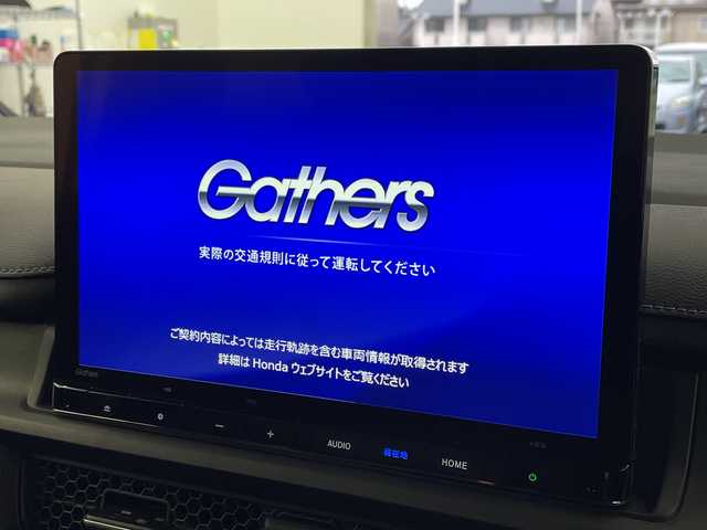 ホンダ ステップワゴン スパーダ eHEV 岐阜県 2025(令7)年 0.1千km プラチナホワイトパール 純正ナビ/(Bluetooth.CD.DVD.フルセグTV)/追従型クルーズコントロール/レーンキープアシスト/横滑り防止/衝突軽減ブレーキ/両側パワースライドドア/パワーバックドア/LEDヘッドライト/オートライト/オートマチックハイビーム/シートヒーター/パドルシフト/バックカメラ/電動格納ミラー/革巻きステアリング