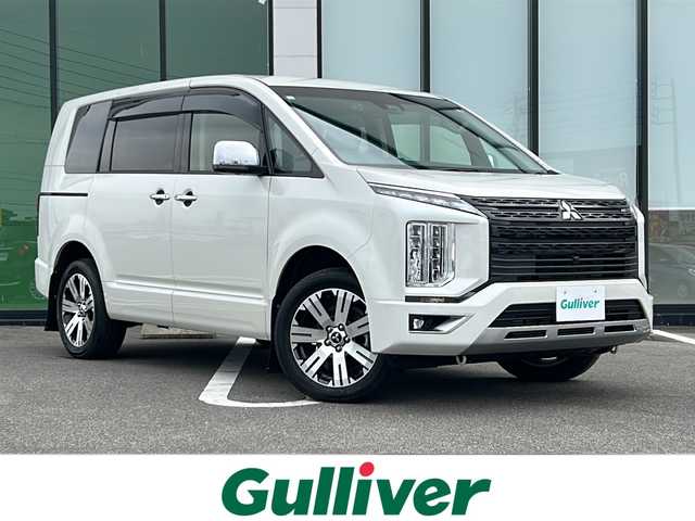 三菱 デリカＤ：５ P 岐阜県 2021(令3)年 3.3万km ウォームホワイトパール 登録時走行距離32590km/純正10.1型ナビ/全方位モニター/フルセグテレビ/後席フリップダウンモニター/シートヒーター/ステアリングヒーター/パワーシート/両側パワースライドドア/オートステップ/パドルシフト/スマートキー/プッシュスタート/USB接続/ETC/Bluetooth接続/クルーズコントロール/社外フロアマット/純正アルミホイール/LEDヘッドライト/オートライト/レーンキープアシスト