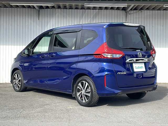 ホンダ フリード ハイブリット G ホンダセンシング 長野県 2016(平28)年 6.8万km コバルトブルーパール Ｓ・ＣコンフォートビューＰＫＧ/純正9型ナビフルセグTV/純正11型フリップダウンモニター/純正ドライブレコーダー/バックカメラ/ビルトインETC/両側パワースライドドア/ハーフレザーシート/純正15インチアルミ/ホンダセンシング/アダクティブクルーズコントロール/保証書・取説・スペアキー