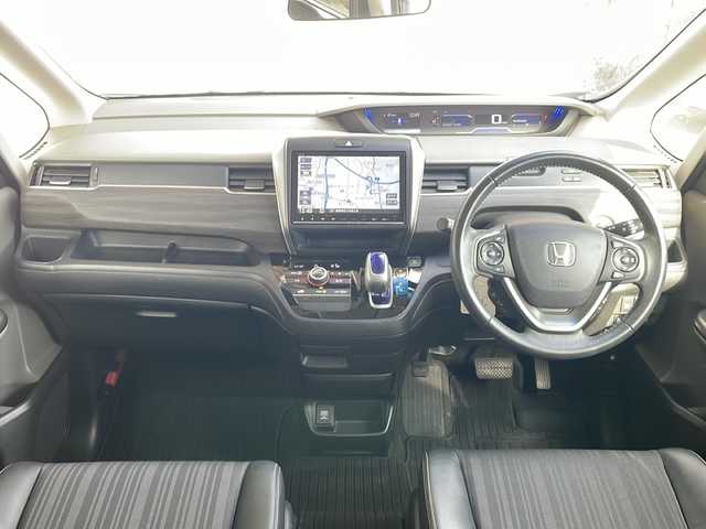 ホンダ フリード ハイブリット G ホンダセンシング 長野県 2016(平28)年 6.8万km コバルトブルーパール Ｓ・ＣコンフォートビューＰＫＧ/純正9型ナビフルセグTV/純正11型フリップダウンモニター/純正ドライブレコーダー/バックカメラ/ビルトインETC/両側パワースライドドア/ハーフレザーシート/純正15インチアルミ/ホンダセンシング/アダクティブクルーズコントロール/保証書・取説・スペアキー