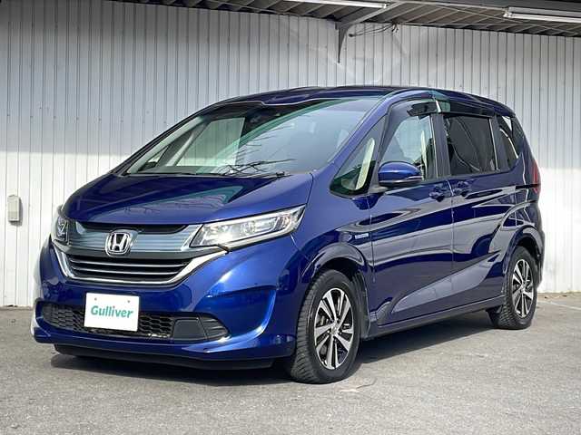 ホンダ フリード ハイブリット G ホンダセンシング 長野県 2016(平28)年 6.8万km コバルトブルーパール Ｓ・ＣコンフォートビューＰＫＧ/純正9型ナビフルセグTV/純正11型フリップダウンモニター/純正ドライブレコーダー/バックカメラ/ビルトインETC/両側パワースライドドア/ハーフレザーシート/純正15インチアルミ/ホンダセンシング/アダクティブクルーズコントロール/保証書・取説・スペアキー