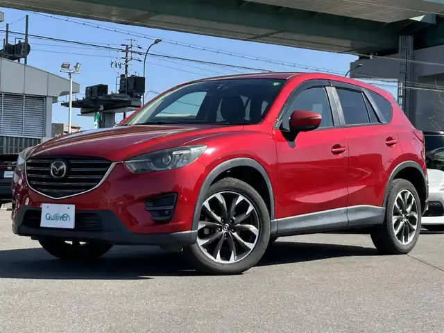 マツダ ＣＸ－５ XD Lパッケージ 愛知県 2015(平27)年 11.4万km ソウルレッドプレミアムメタリック メーカーナビ（AM/FM/フルセグ/BT/CD/DVD）/バック・サイドカメラ/スマートブレーキアシスト/レーンキープアシストシステム/パーキングセンサー/クルーズコントロール/ブラインドスポットモニター/レザーシート/D/N席シートヒーター/D/N席パワーシート/革巻きステアリング/純正18インチAW/純正フロアマット/ドアバイザー/フォグランプ/LEDヘッドライト/保証書・取扱説明書