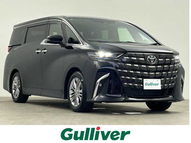トヨタ アルファードハイブリット Z 千葉県 2025(令7)年 0.1万km ブラック 禁煙車/両側電動ドア/パワーバックドア/左右独立ムーンルーフ/トヨタセーフティセンス/・レーンディパーチャーアラート/・レーンキープアシスト/・ブラインドスポットモニター/・プリクラッシュセーフティ/・プリクラッシュセーフティブレーキ/・クリアランスソナー/・レーダークルーズコントロール/純正14インチディスプレイオーディオ/・コネクティッドナビ付き/・Bluetooth/フルセグTV/・パノラミックビューモニター/・ビルトインETC2.0/・デジタルインナーミラー/左右独立エアコン/置くだけ充電/革巻きステアリング/・ステアリングスイッチ/・ステアリングヒーター/レザーシート/・D席メモリ付き/・DNセカンドパワーシート/・DNセカンドシートヒーター/・DNセカンドエアーシート/・オットマン/電子パーキング/・ブレーキホールド/オートライト/・オートマチックハイビーム/・三眼LEDヘッドライト/・LEDフォグランプ/・シーケンシャルウインカー/純正フロアマット/純正18インチAW