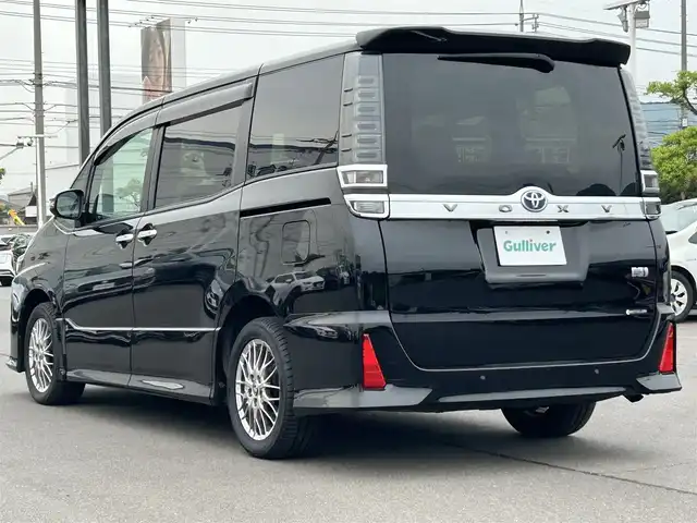 トヨタ ヴォクシー ハイブリッド ZS 煌Ⅱ 岡山県 2020(令2)年 6.3万km ブラック 登録時走行距離62587km/アルパインBIG-X11インチナビ/アルパイン後席フリップダウンモニター/フルセグTV/（AM.FM.CD.DVD.BT)/バックカメラ/ETC/衝突被害軽減ブレーキ/ドライブレコーダー/レーンキープアシスト/横滑り防止装置/クリアランスソナー/クルーズコントロール/両側パワースライドドア/シートヒーター/オートマチックハイビーム/オートライト/LEDライト/16インチ純正AW/Bluetooth/アイドリングストップ