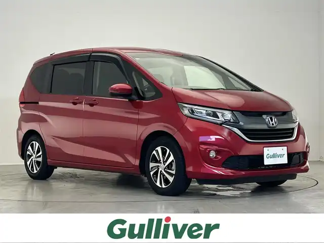 ホンダ フリード G ホンダセンシング 滋賀県 2018(平30)年 4.3万km プレミアムクリスタルレッドM 禁煙車/社外7インチナビ/（AM/FM/CD/DVD/TV/USB/SD/Bluetooth）/両側パワースライドドア/ホンダセンシング/-アダクティヴクルーズコントロール/-衝突軽減ブレーキ/-誤発進抑制機能/-路外逸脱抑制機能/バックカメラ/ドライブレコーダー/ビルトインETC/革巻きステアリング/ステアリングスイッチ/ウッド調パネル/ハーフレザーシート/電動格納ミラー/オートライト