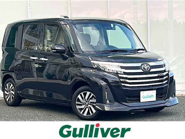 トヨタ ルーミー カスタムG 福岡県 2023(令5)年 2.1万km ブラックマイカメタリック ・純正9インチディスプレイオーディオ/-BT/フルセグ/AppleCarPlay/AndroidAuto/・バックカメラ/・レーダークルーズコントロール/・衝突軽減ブレーキ/・クリアランスソナー/・前後ドライブレコーダー【ZDR035】/・電動パーキングブレーキ/・ブレーキホールド/・オートライト/・オートハイビーム/・ステアリングリモコン/・サンシェード/・ウィンカーミラー/・横滑り防止装置/・車線逸脱警報/・LEDヘッドライト/・フォグランプ/・純正アルミ14インチ/・純正フロアマット/・スマートキー/・スペアキー×１