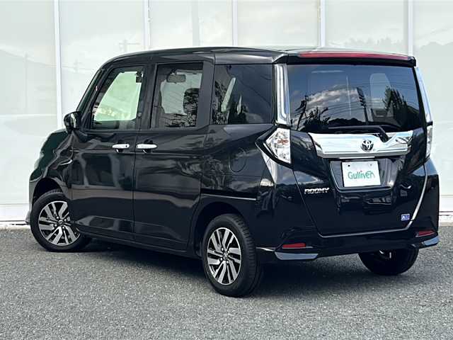 トヨタ ルーミー カスタムG 福岡県 2023(令5)年 2.1万km ブラックマイカメタリック ・純正9インチディスプレイオーディオ/-BT/フルセグ/AppleCarPlay/AndroidAuto/・バックカメラ/・レーダークルーズコントロール/・衝突軽減ブレーキ/・クリアランスソナー/・前後ドライブレコーダー【ZDR035】/・電動パーキングブレーキ/・ブレーキホールド/・オートライト/・オートハイビーム/・ステアリングリモコン/・サンシェード/・ウィンカーミラー/・横滑り防止装置/・車線逸脱警報/・LEDヘッドライト/・フォグランプ/・純正アルミ14インチ/・純正フロアマット/・スマートキー/・スペアキー×１